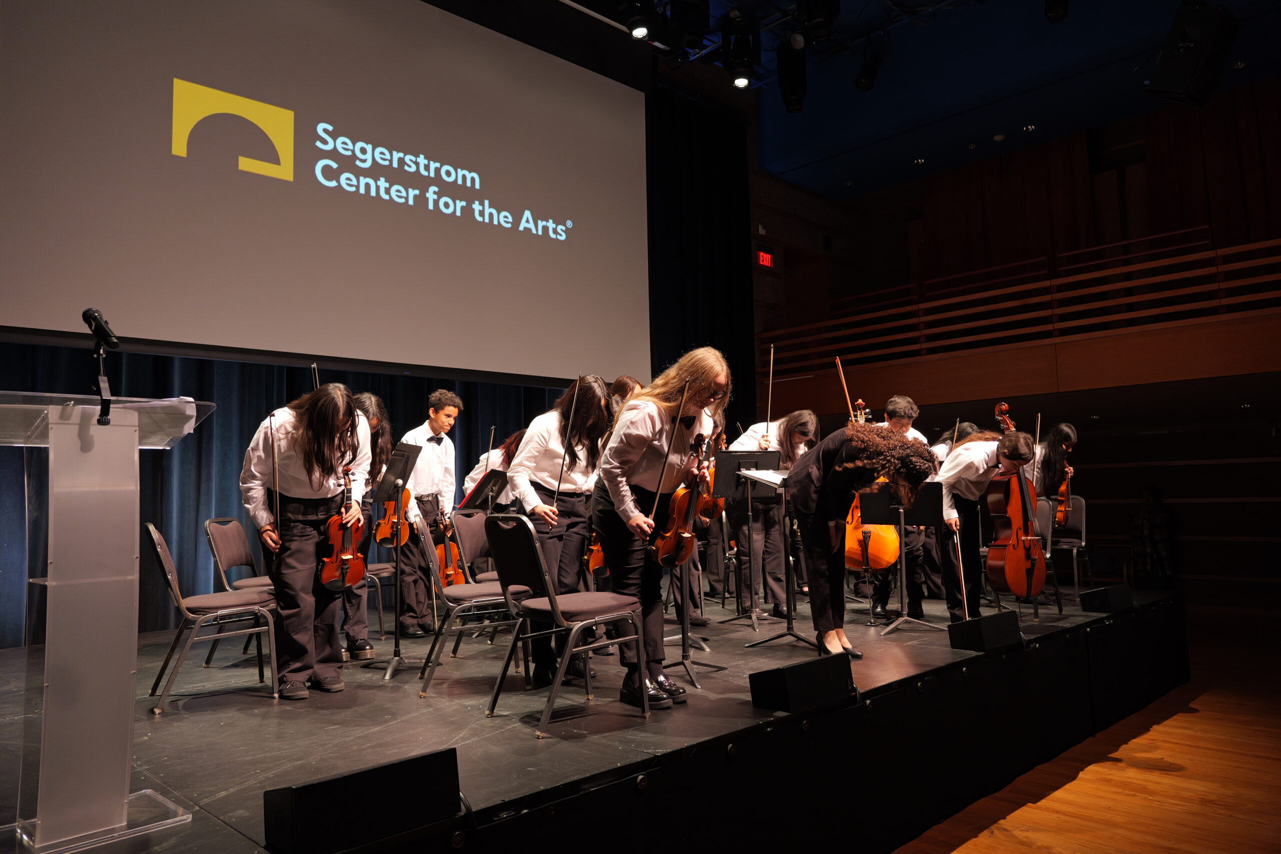 Jennifer Garcia, a music teacher from the Placentia-Yorba Linda Unified School District, and her advanced orchestra students take a bow after their performance at the 2025 Orange County Music and Arts Administrators Awards ceremony.