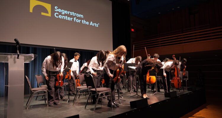 Jennifer Garcia, a music teacher from the Placentia-Yorba Linda Unified School District, and her advanced orchestra students take a bow after their performance at the 2025 Orange County Music and Arts Administrators Awards ceremony.