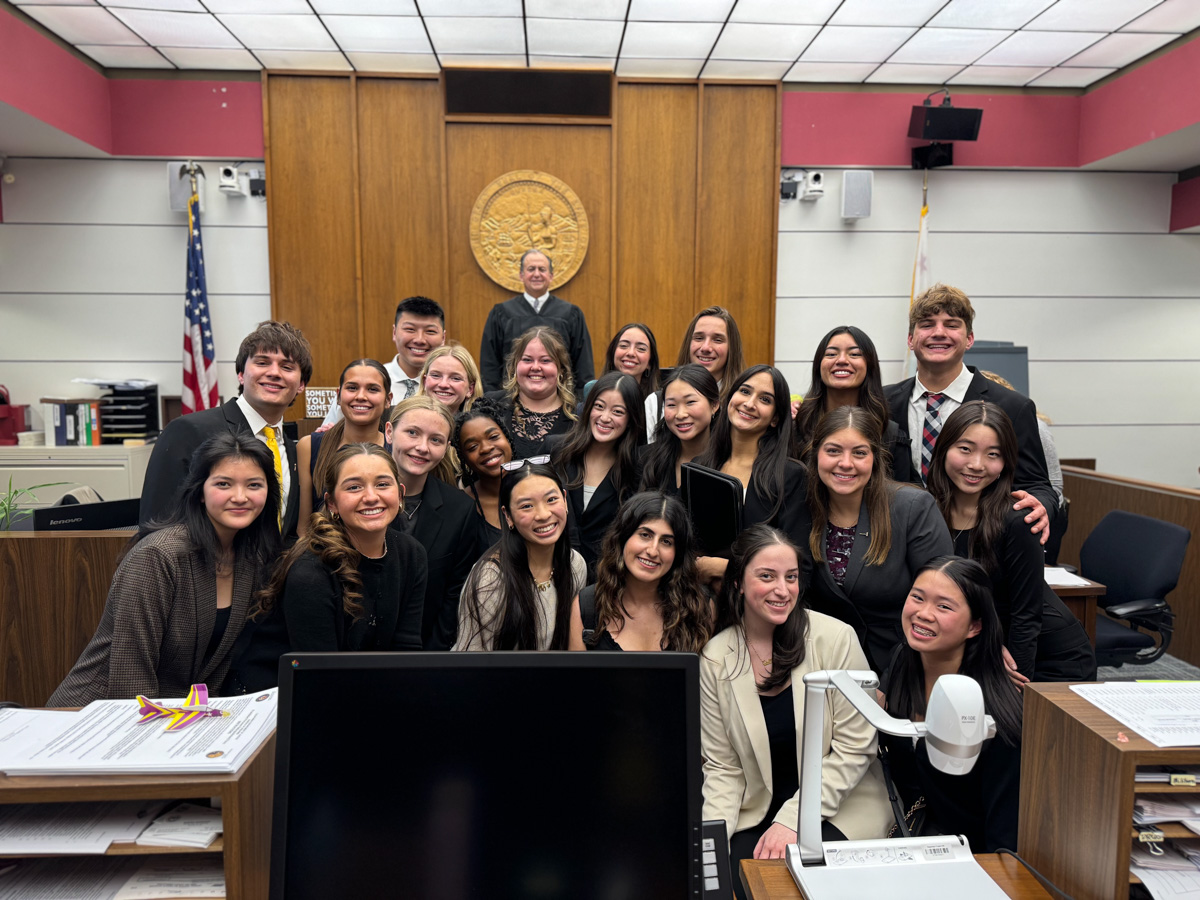 The El Dorado High School mock trial team celebrates their victory alongside Justice Thomas Delaney, the presiding judge. (Photo courtesy of the Placentia-Yorba Linda Unified School District)