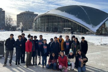 Members of Troy High School’s Science Olympiad team stand outside the Kresge Auditorium at the Massachusetts Institute of Technology during the 2025 MIT Science Olympiad Invitational.