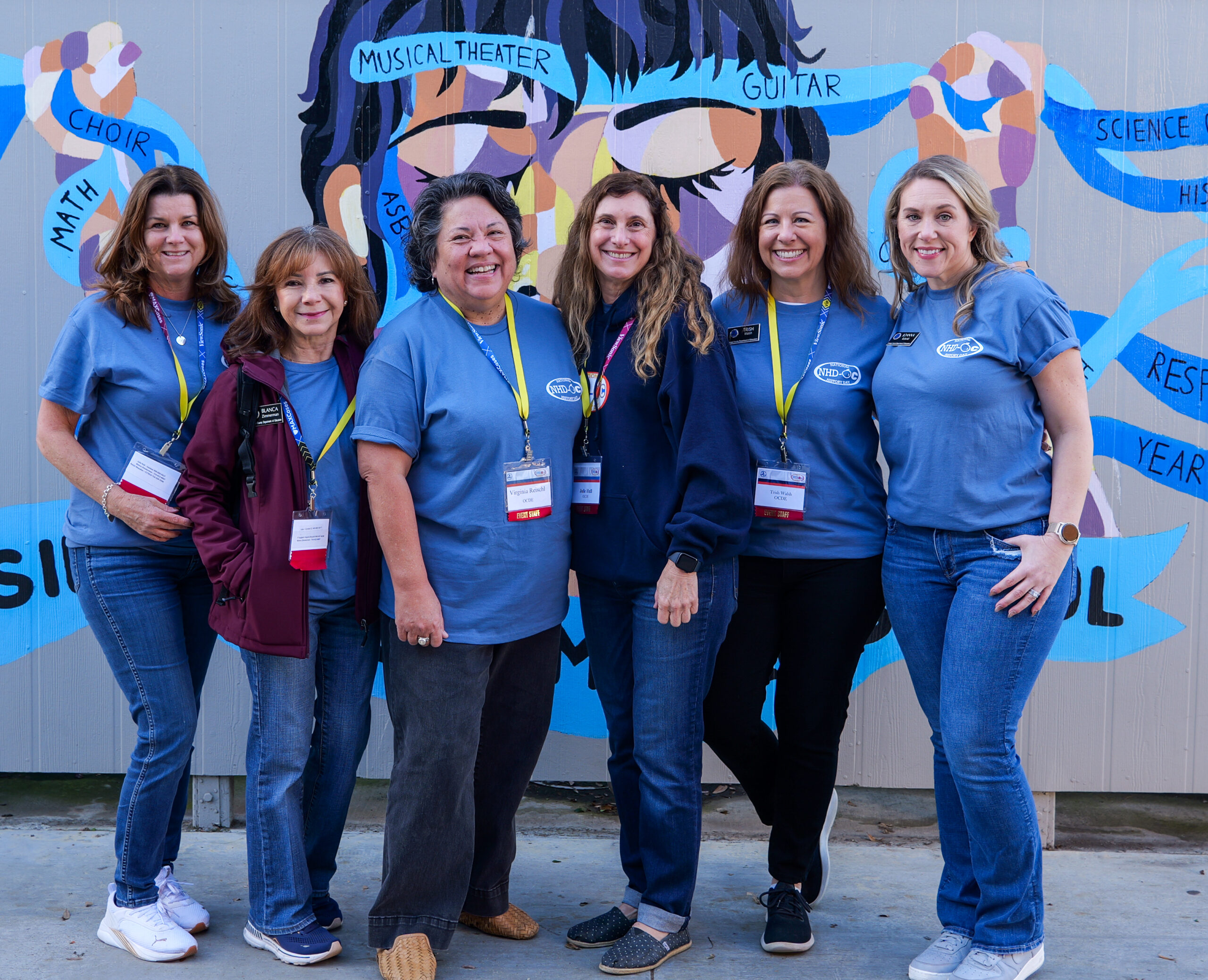 Dr. Virginia Reischl and Julie Hull (center), co-coordinators of National History Day-OC, pose with OCDE colleagues during the NHD-OC competition in Irvine on March 9.