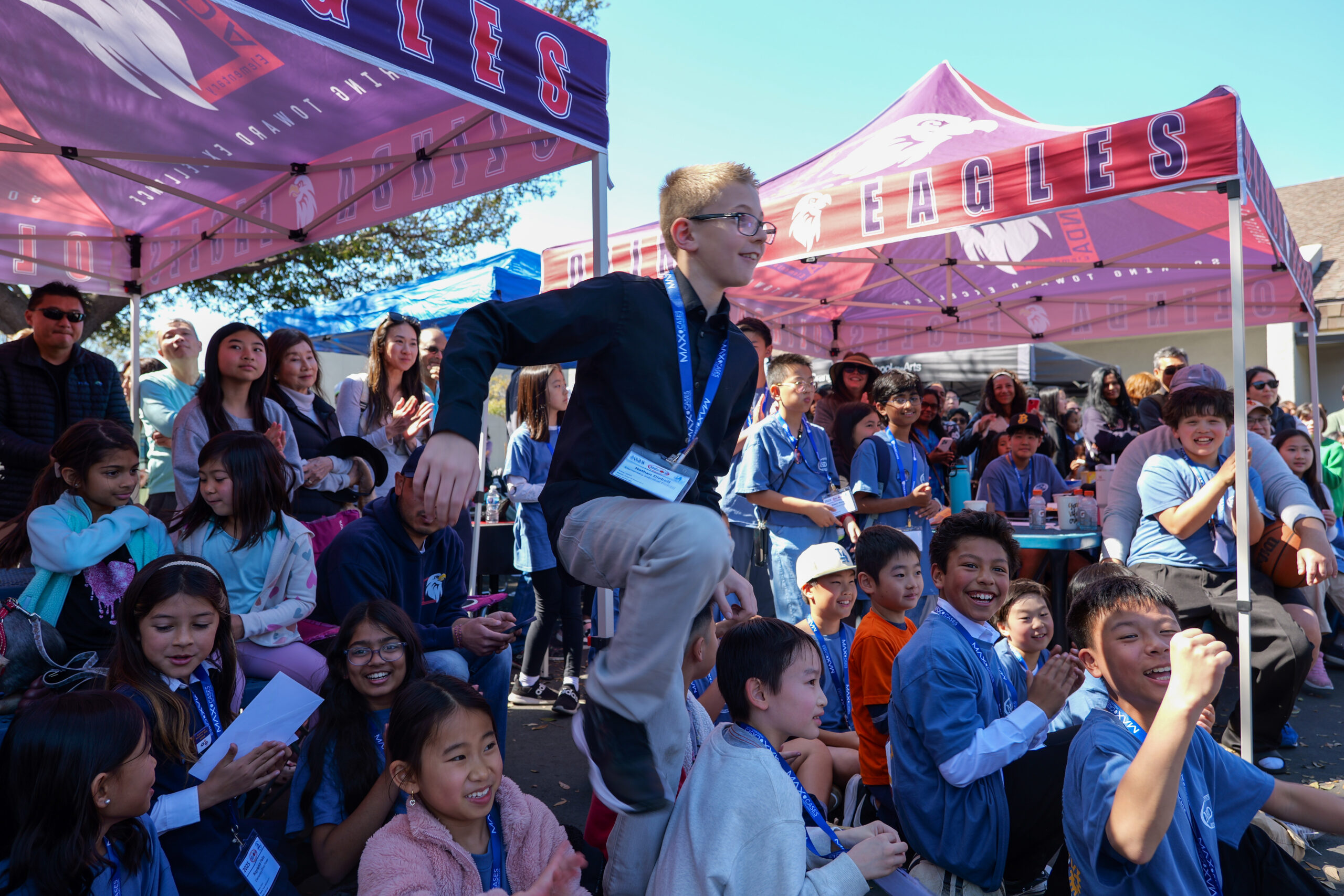 Supporters cheer as a student is called to present during the NHD-OC competition.