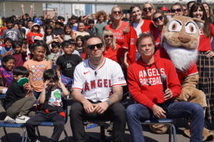 Los Angeles Angels shortstop Zach Neto and sports radio host Roger Lodge visit College Park Elementary students in Costa Mesa May 9. (Angels Baseball Foundation)