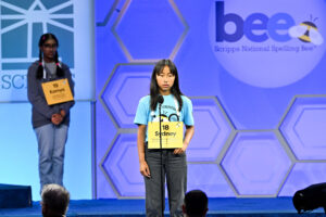 Speller Sydney Tran, of Irvine, California, representing The Orange County Register/O.C. Department of Education, competes in a preliminary round for the 2025 Scripps National Spelling Bee on May 27, 2025 in National Harbor, MD. ph: Craig Hudson / Scripps National Spelling Bee