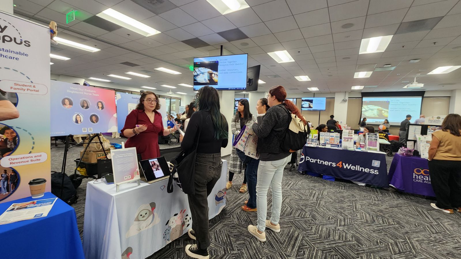 Participants visit vendor tables during the inaugural Thrive Resource Fair in 2024, hosted by the Orange County Department of Education. 