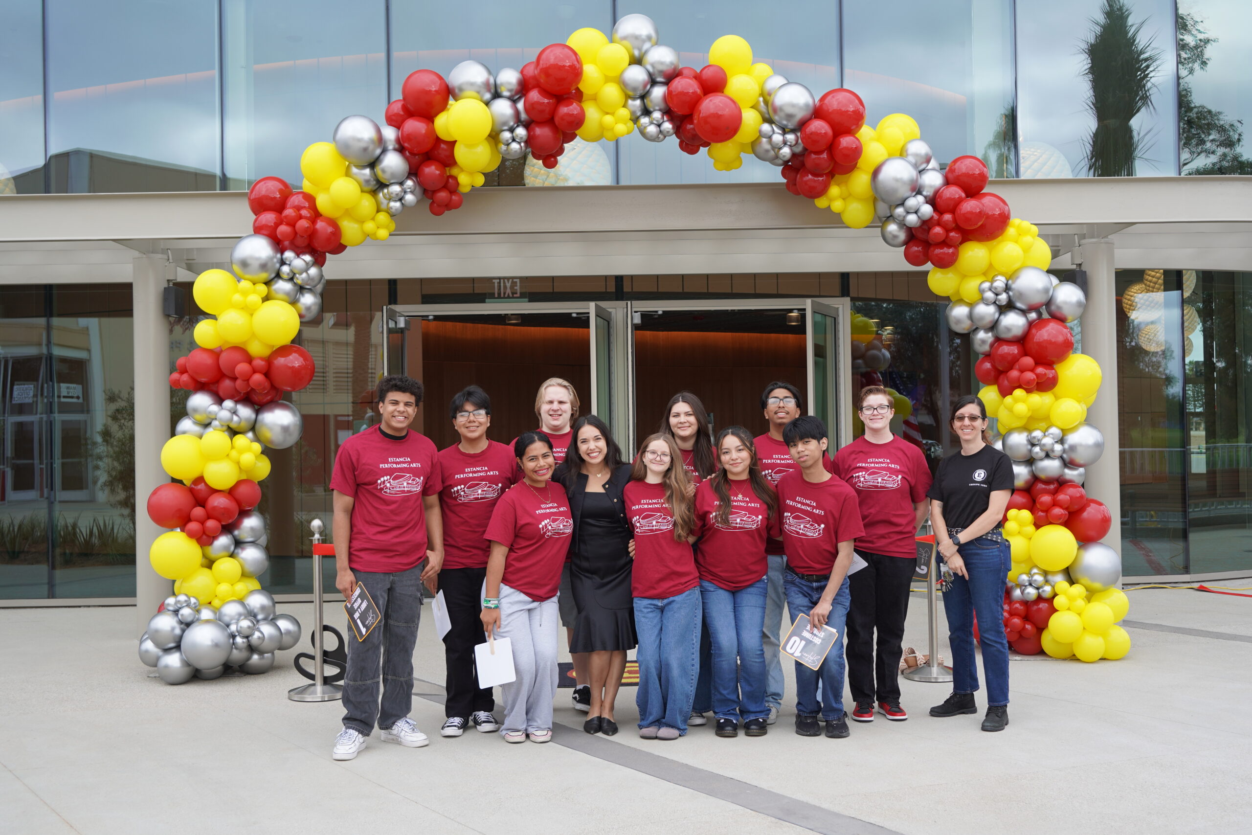 Estancia High School advanced drama students and drama teacher Amber Reyes celebrate the opening of the performing arts venue. 