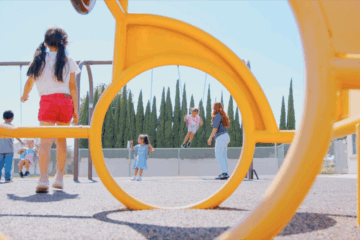 Youth apprentice playing with children