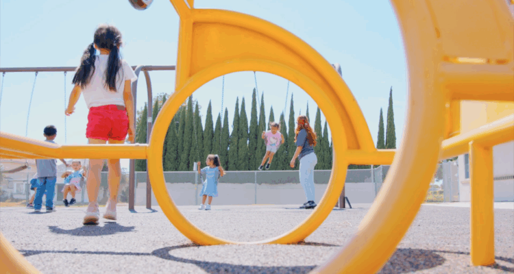 Youth apprentice playing with children