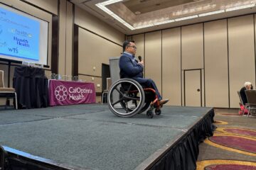 Dr. Stefan Bean speaks on stage at the SBHIP Partners Appreciation Luncheon