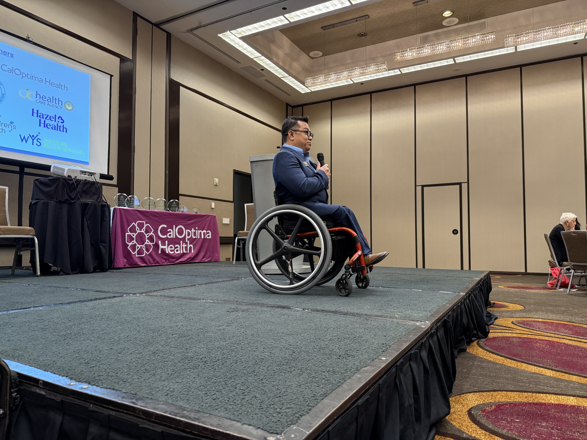 Dr. Stefan Bean speaks on stage at the SBHIP Partners Appreciation Luncheon