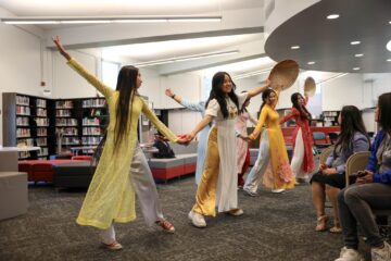 Westminster High School students performed a traditional Vietnamese dance in áo dài attire during the March 20, 2024, celebration of the Vietnamese Dual Language Immersion program pathway.