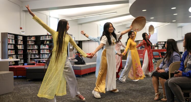 Westminster High School students performed a traditional Vietnamese dance in áo dài attire during the March 20, 2024, celebration of the Vietnamese Dual Language Immersion program pathway.