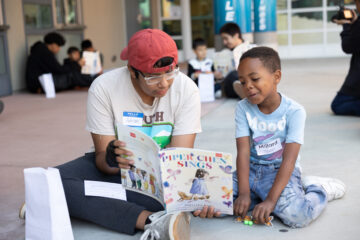 Eighth-grade students from Valadez Middle School Academy read "Piper Chen Sings" with first graders from Melrose and Rio Vista elementary schools during the 15th annual Read for the Record event on Oct. 26, 2024. The celebration, part of a worldwide literacy campaign, promotes the importance of early reading and language development.