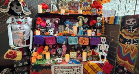 Alternative education students at OCDE's Argosy campus site helped create an altar for Dia de los Muertos with the help of school staff.