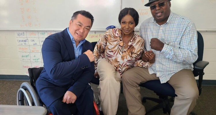 Orange County Superintendent Dr. Stefan Bean meets former heavyweight boxing champion James "Buster" Douglas and his wife, Bertha Douglas, during their visit to OCDE's Otto Fischer School.