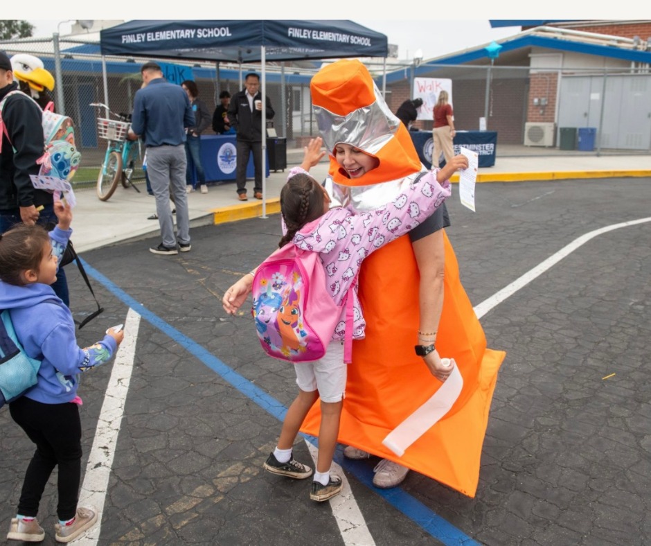A student greets an administrator upon arriving at her school in Westminster. (Photos courtesy of Westminster School District)