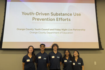 Five student leaders from the Orange County Youth Council pose for a photo at the Red Ribbon in Action event, held Oct. 29 at the OCDE Conference Center.