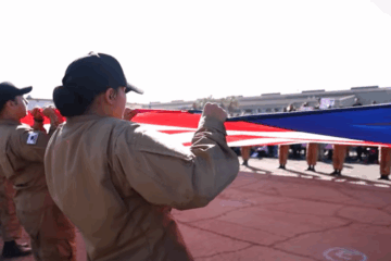 Students unfurling giant U.S. flag