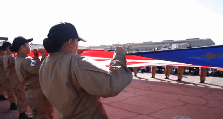 Students unfurling giant U.S. flag