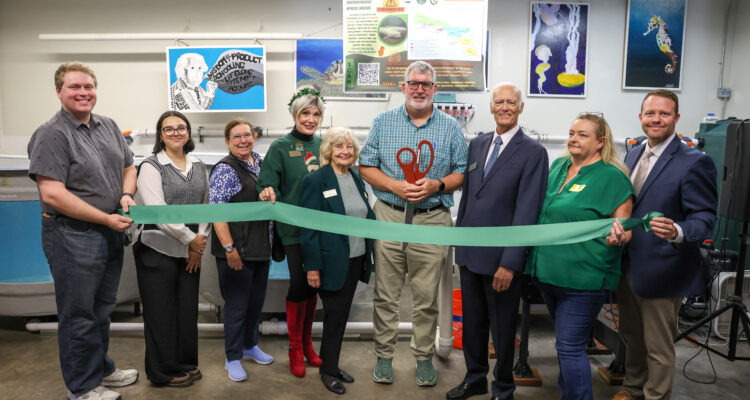 Huntington Beach Union High School District educators, administrators and board trustees celebrate the start of a new partnership between Edison High School and the California Department of Fish and Wildlife. (Huntington Beach Union High School District)