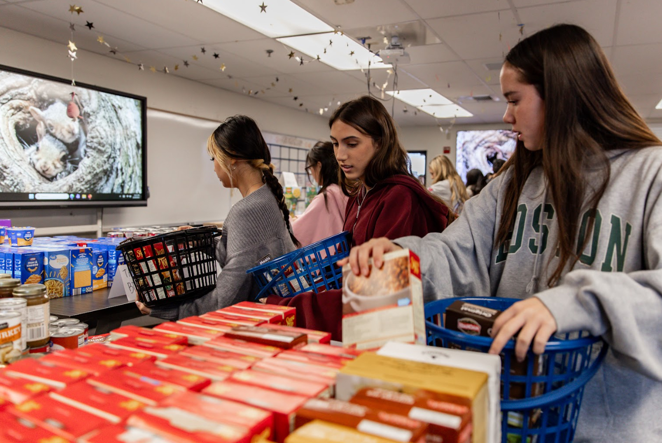 Sunny Hills High School students helped organize 93 baskets of Thanksgiving groceries to donate to local nonprofit Pathways for Hope at their food drive event.