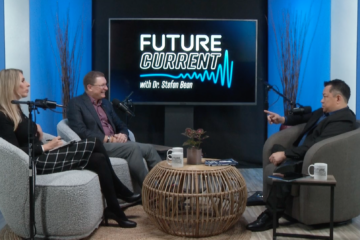 Dr. Stefan Bean speaks with Eric L. Goodman and Lainie Rowell on the FutureCurrent podcast set, with microphones and chairs arranged for a recorded conversation.