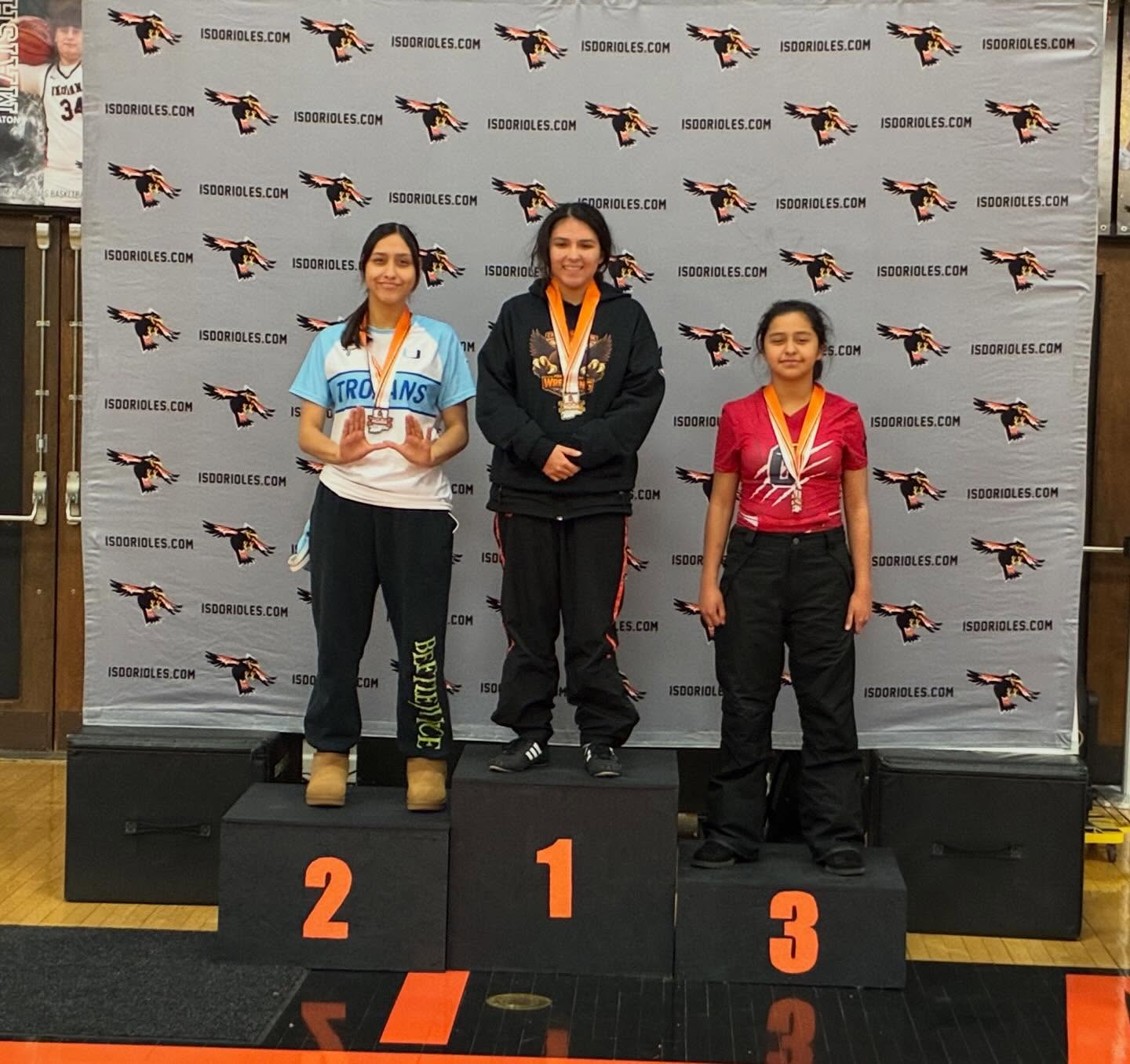 Ayiana Tierney receives her medal at the Willigan Wresting Tournament after finishing second in the girls, division under 120 pounds.