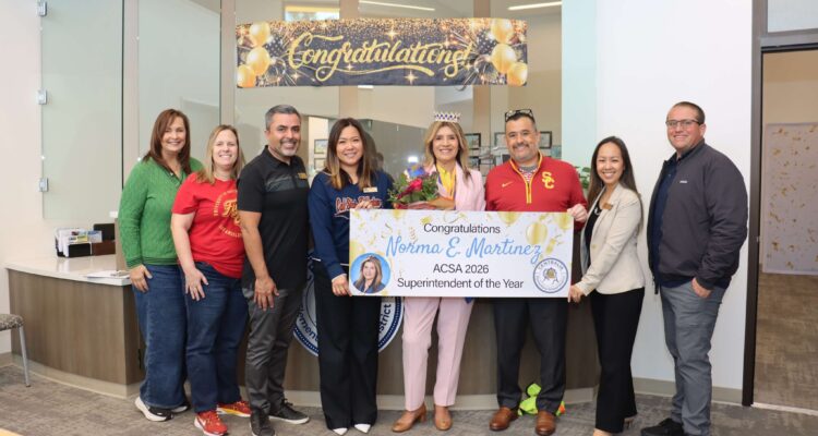 Dr. Norma E. Martinez (center) stands with Centralia School District colleagues holding a sign recognizing her as the 2026 ACSA Region 17 Superintendent of the Year.
