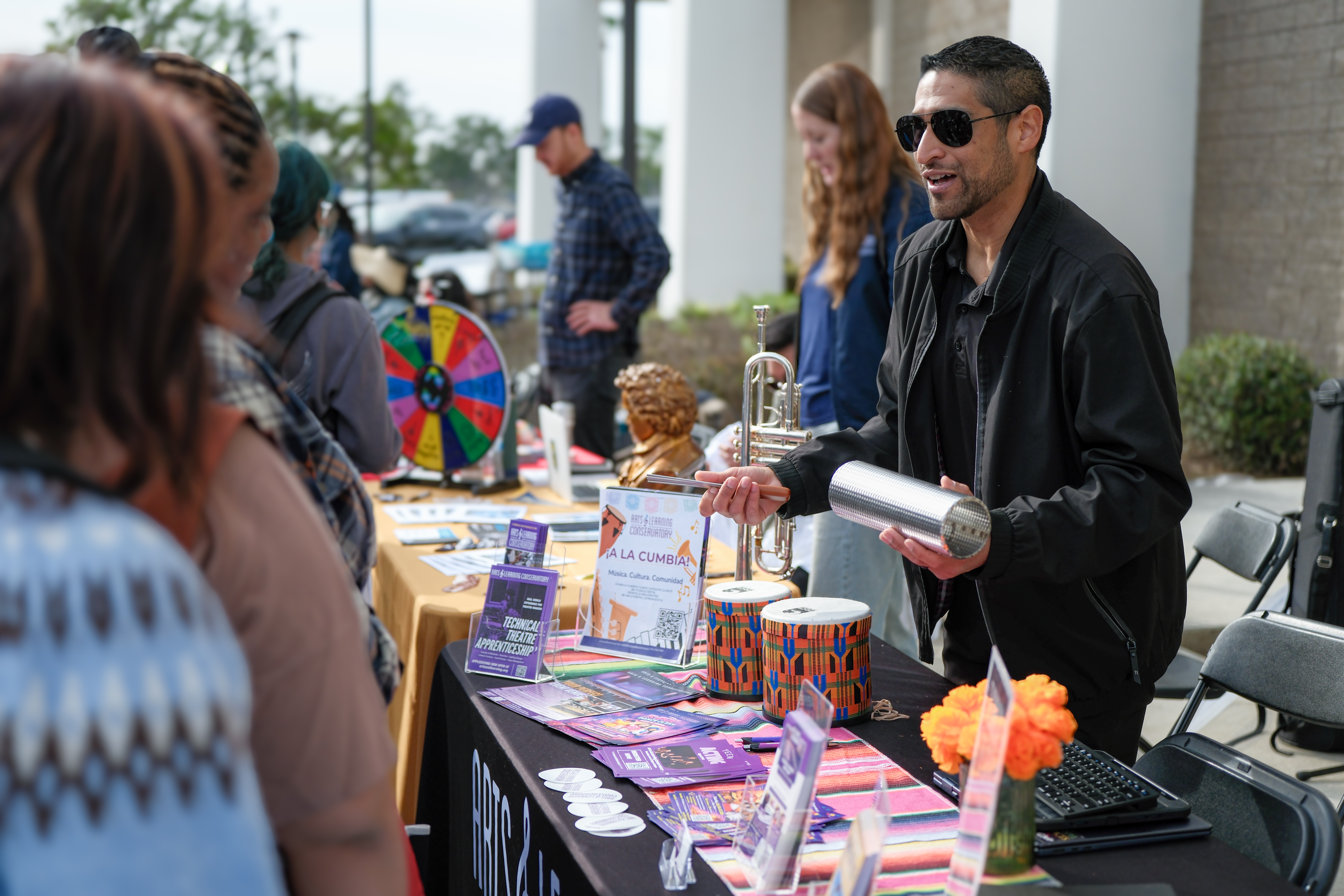 High school students from seven OC school districts connect with future employers at information booths in the Santa Ana College campus quad.