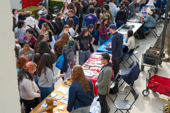 High school students from seven OC school districts connect with future employers at information booths in the Santa Ana College campus quad.