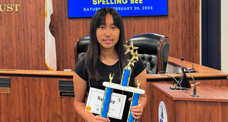 Sydney Tran holds her championship trophy after winning the 2026 Orange County Spelling Bee.