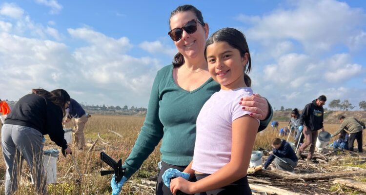 Volunteers take part in a previous Inside the Outdoors cleanup event at Upper Newport Bay in Newport Beach.