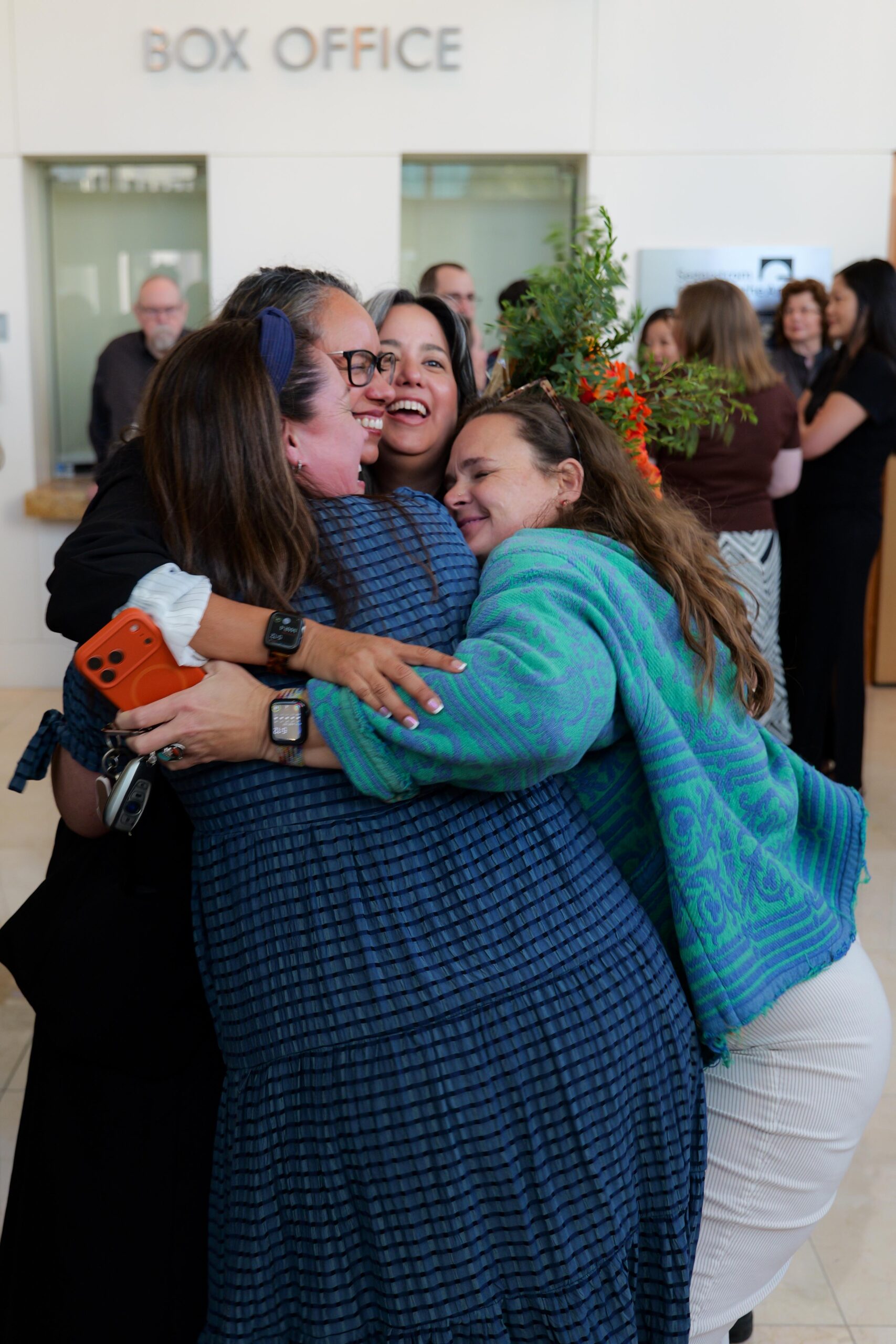 Attendees greet one another in the lobby of the Samueli Theater before the start of the 2026 OCMAA Awards ceremony.
