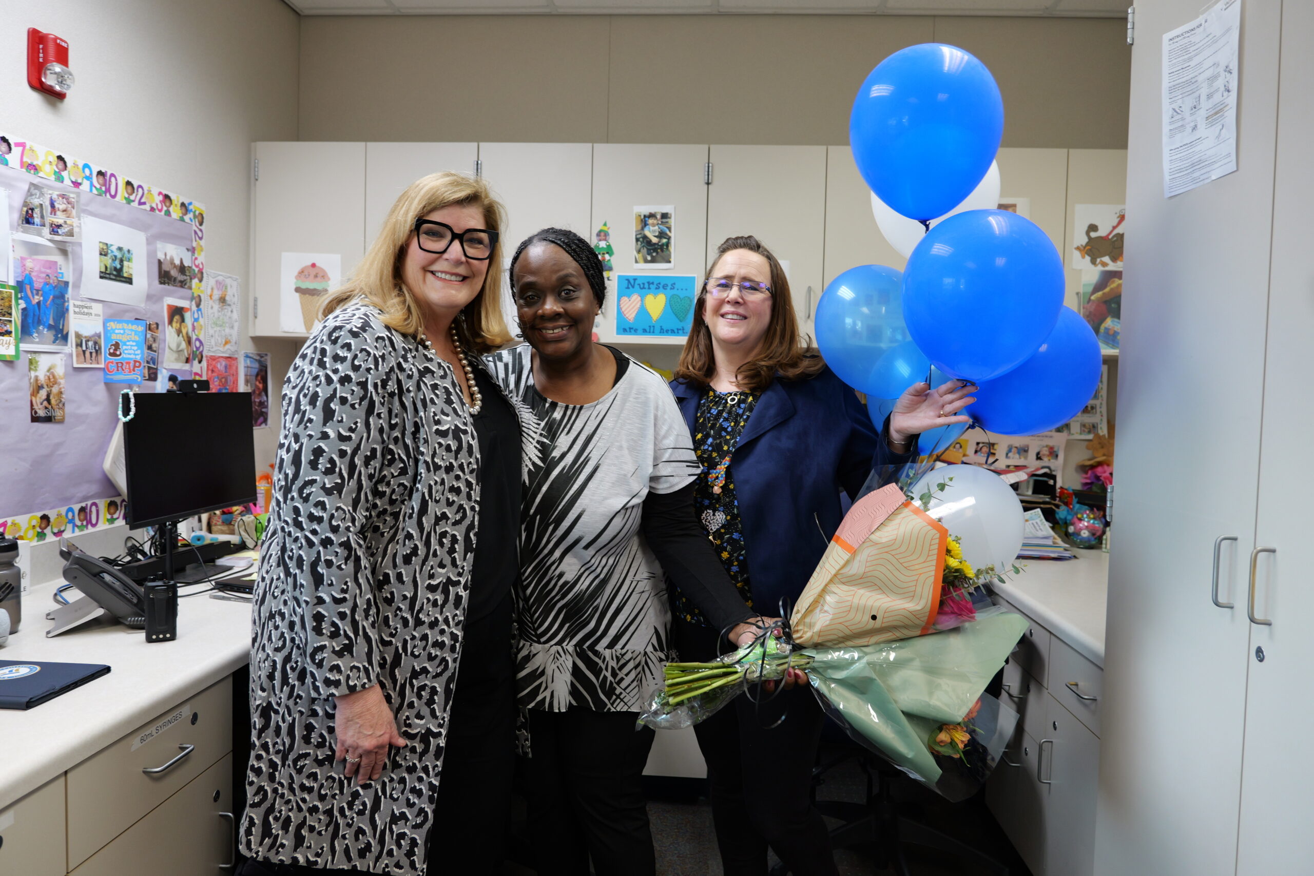 Donna Irumundomon, licensed vocational nurse with OCDE’s Connections program, stands with colleagues and program leaders after being named the 2026 Orange County Classified School Employee of the Year in Health and Student Services.