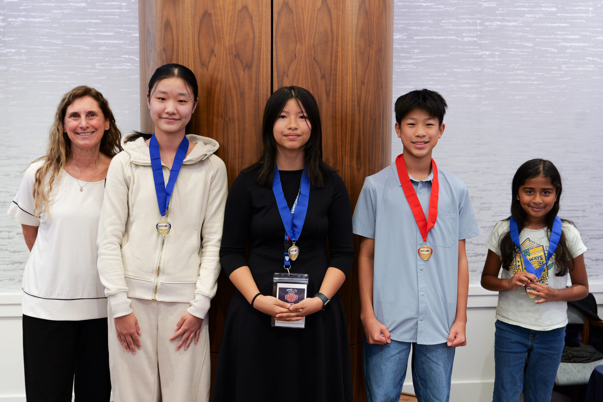 Students from the NHD-OC elementary division receive receive medals from OCDE Coordinator Julie Hull at the March 18 ceremony.