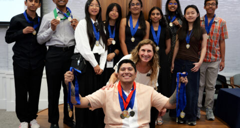 Venado Middle School students pose with their multiple NHD-OC medals alongside teacher and coach Hector Gamboa, and OCDE Coordinator Julie Hull.