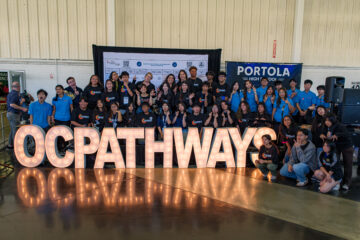 OCDE Executive Director Kathy Boyd and Administrator Kim Goodwin pose with the OC Pathways student ambassadors at the 12th annual OC Pathways Showcase at the OC Fairgrounds.