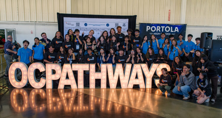 OCDE Executive Director Kathy Boyd and Administrator Kim Goodwin pose with the OC Pathways student ambassadors at the 12th annual OC Pathways Showcase at the OC Fairgrounds.