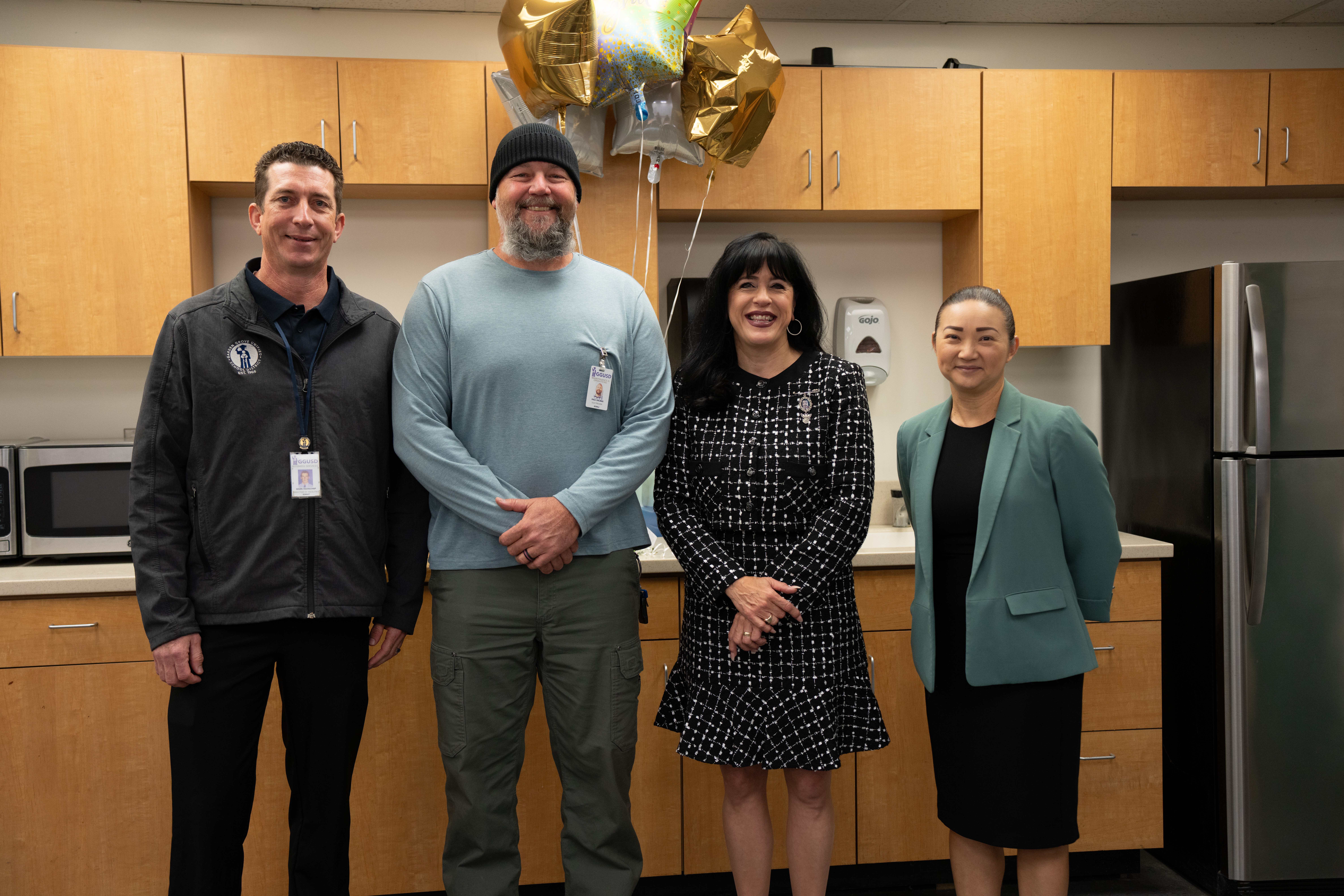 Paul Dalmas, electrician for the Garden Grove Unified School District, poses with maintenance team members after being named his district’s Classified School Employee of the Year. He later received county recognition in Skilled Trade Services.