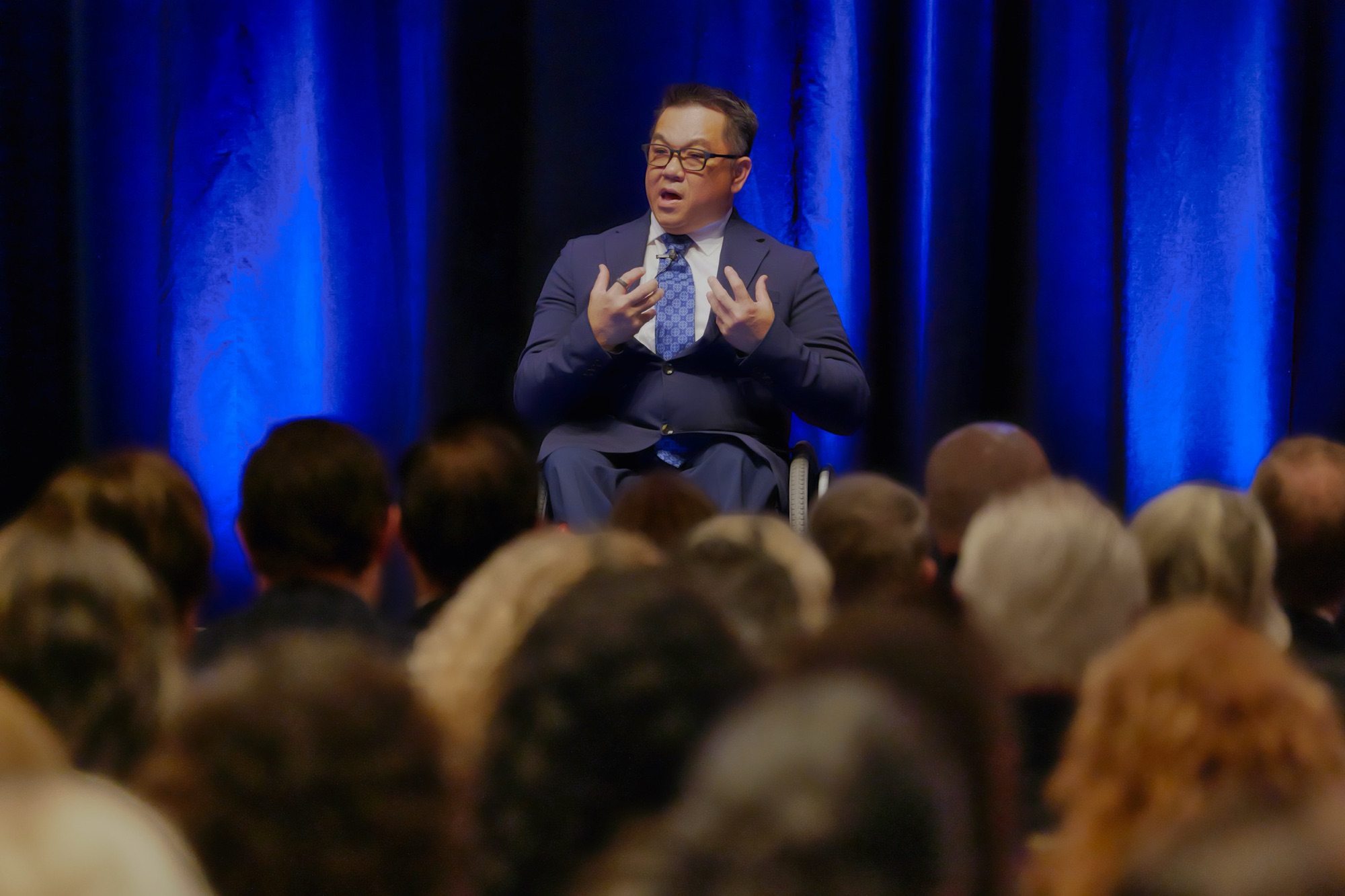 Dr. Stefan Bean speaking on stage