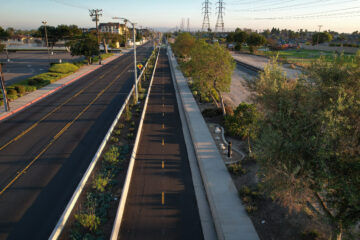 Aerial view of the Mendez Freedom Trail running alongside Hoover Street in Westminster, featuring a protected bikeway and landscaped path.