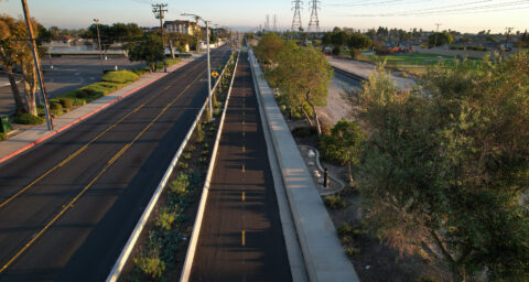 Aerial view of the Mendez Freedom Trail running alongside Hoover Street in Westminster, featuring a protected bikeway and landscaped path.