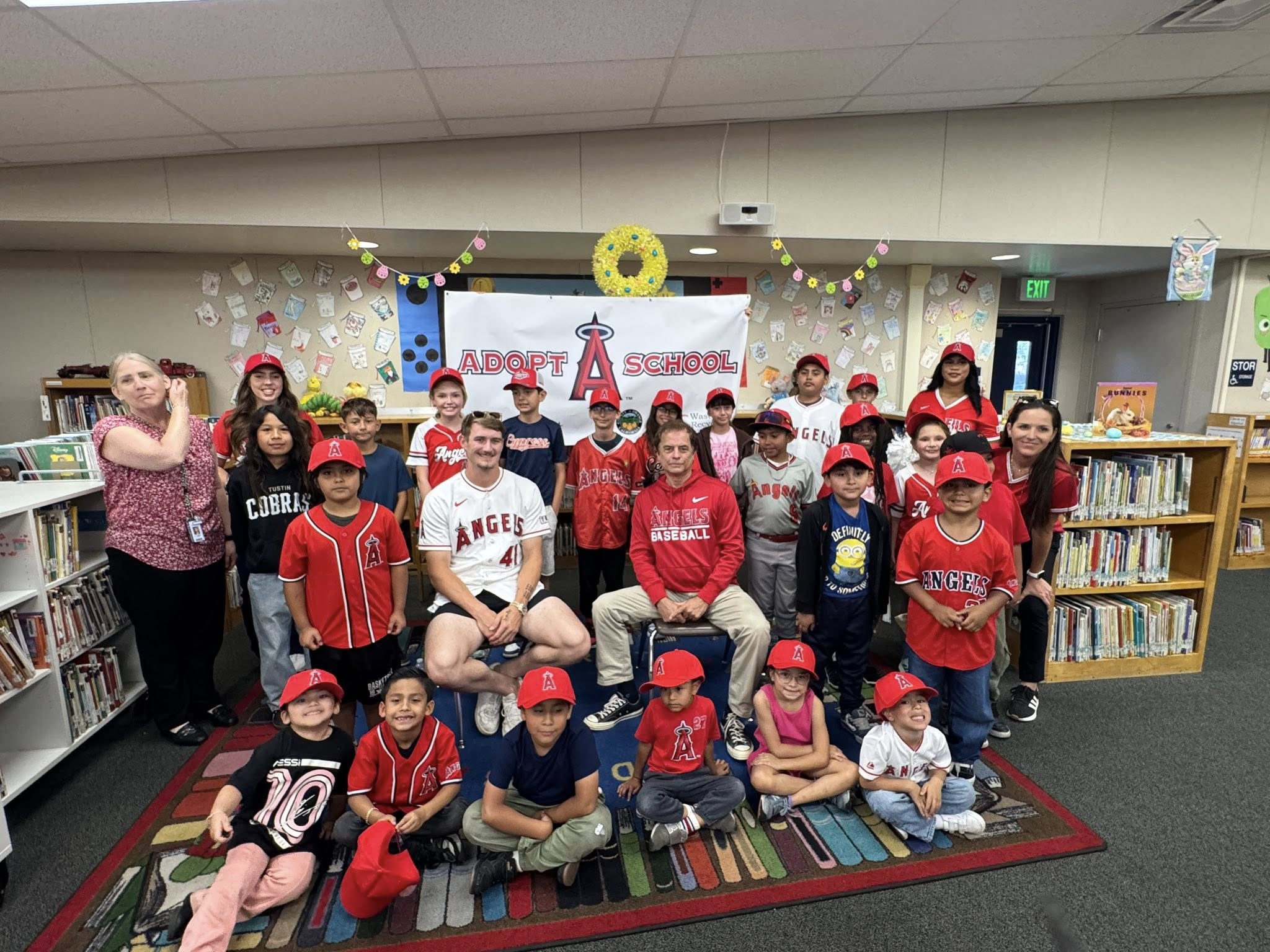 Students sit together in the library during an Angels Adopt-A-School visit at Gauer Elementary School in Anaheim.