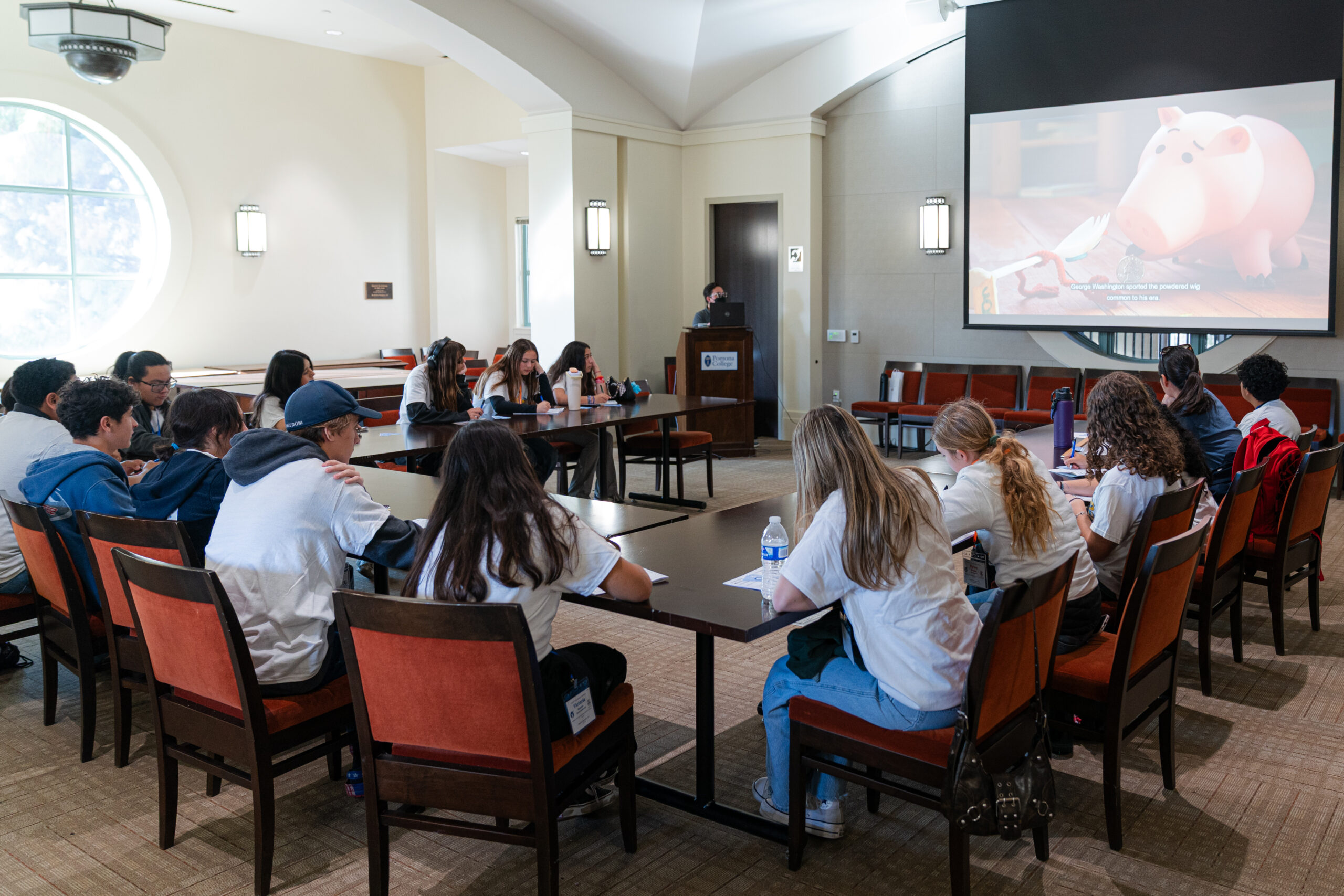 Orange County high school students take notes during a lecture at the AVID 9th Grade Leadership Conference at Pomona College.