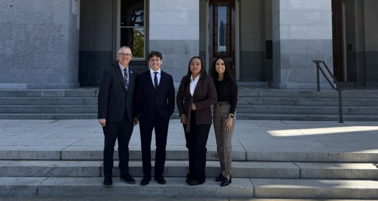 Coastline ROP Superintendent Brian Dozer, left, stands with Laguna Hills High School student Reece Ayala, Estancia High School student Rosselyn Ruiz and Coastline ROP Educational Services Administrator Gina Escobar on the steps of the California State Capitol in Sacramento.