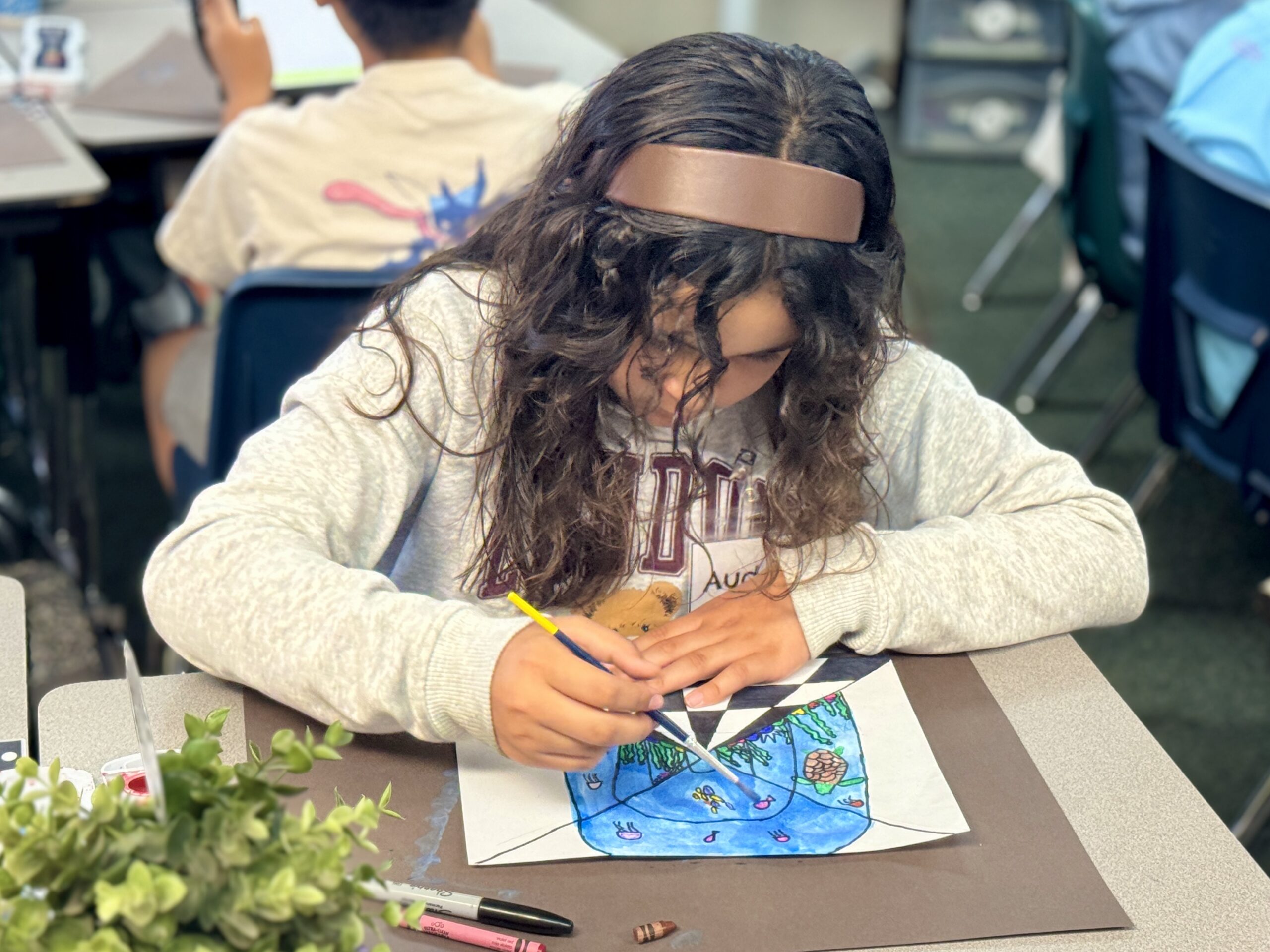 A student at Beechwood School in the Fullerton Unified School District works on an art project.