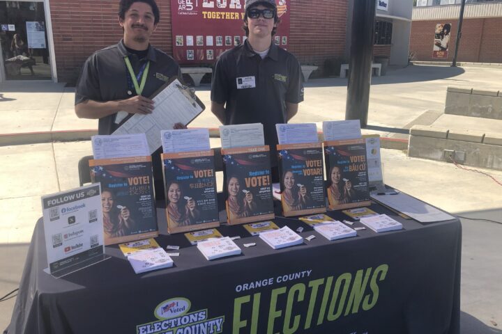 Representatives from the Orange County Registrar of Voters host a voter education booth at Loara High School in the Anaheim Union High School District on March 12.