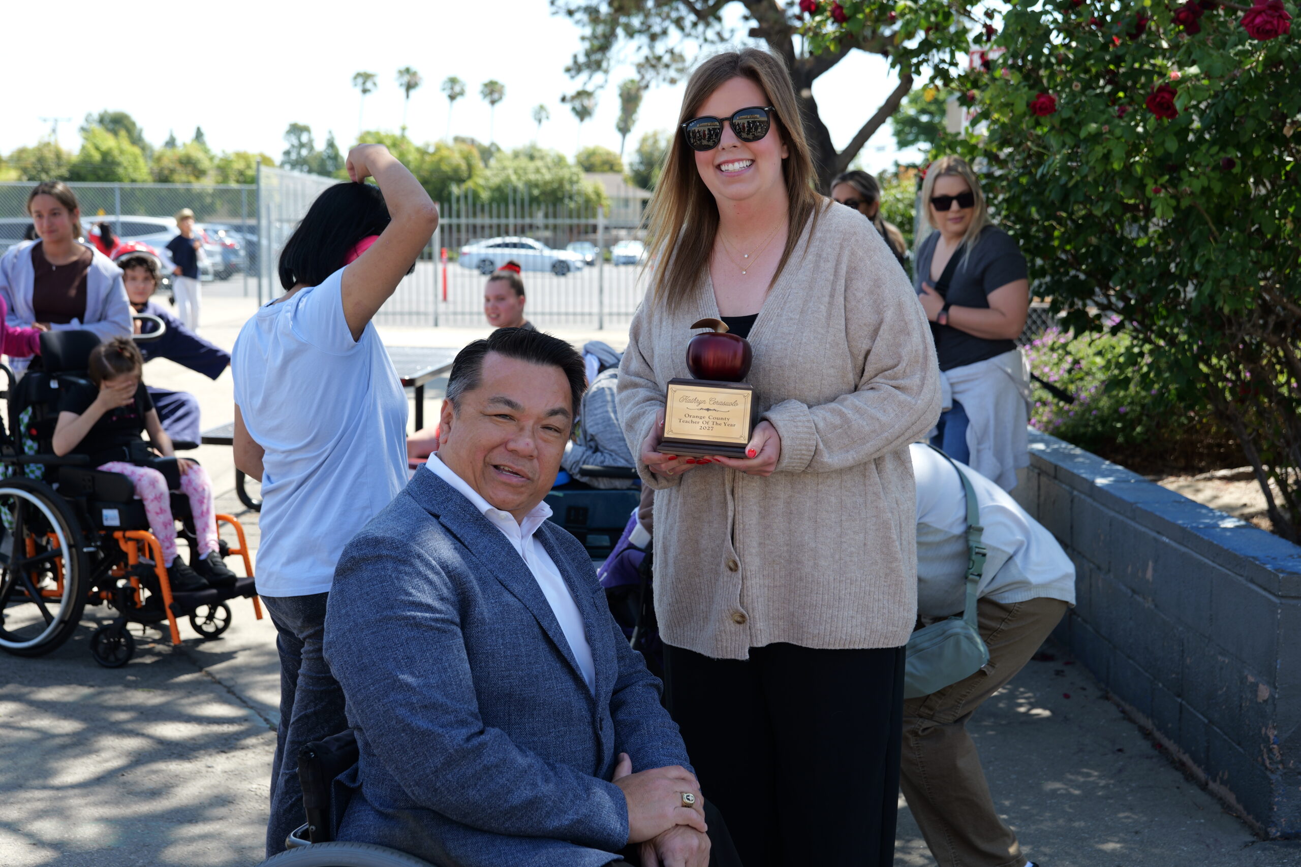 Kathryn “Coach K” Cerasuolo, an adapted physical education teacher at Hope School in the Anaheim Union High School District, is surprised by Orange County Superintendent of Schools Dr. Stefan Bean as her students and colleagues look on after she is named a 2027 Orange County Teacher of the Year.