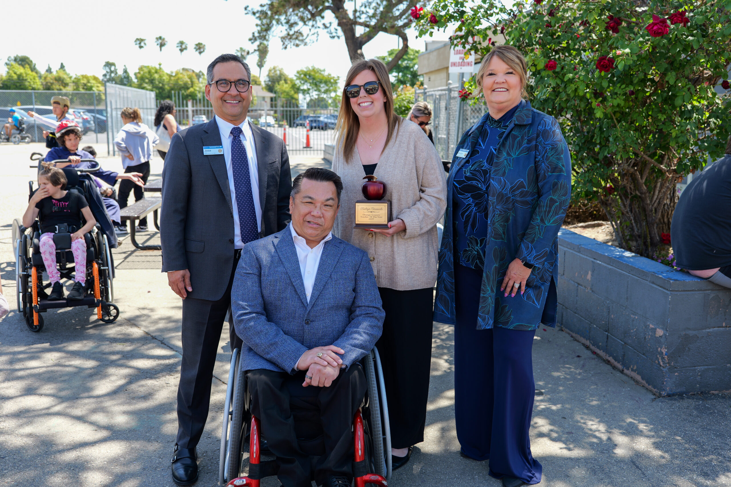 Kathryn “Coach K” Cerasuolo, an adapted physical education teacher at Hope School in the Anaheim Union High School District, is surprised by Orange County Superintendent of Schools Dr. Stefan Bean and representatives from premier sponsor, SchoolsFirst Federal Credit Union, as her students and colleagues look on after she is named a 2027 Orange County Teacher of the Year.
