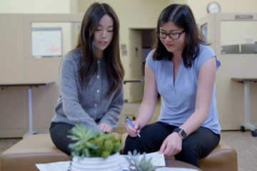 UC Irvine student apprentice Alina Yuan, left, collaborates with marketing program manager Kimberly Chai on design concepts for Division of Career Pathways materials at UC Irvine.